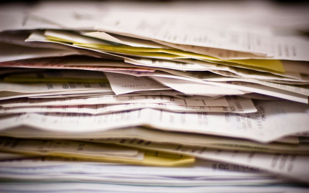 A stack of paper receipts